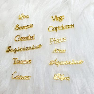 Dije Exotic Nails Zodiaco Dorado
