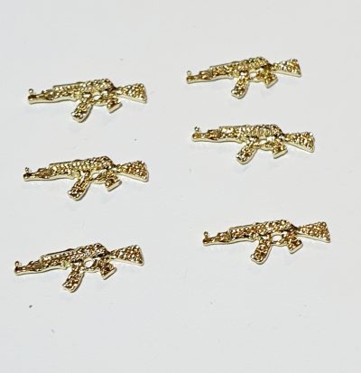Set de dijes de mini pistola